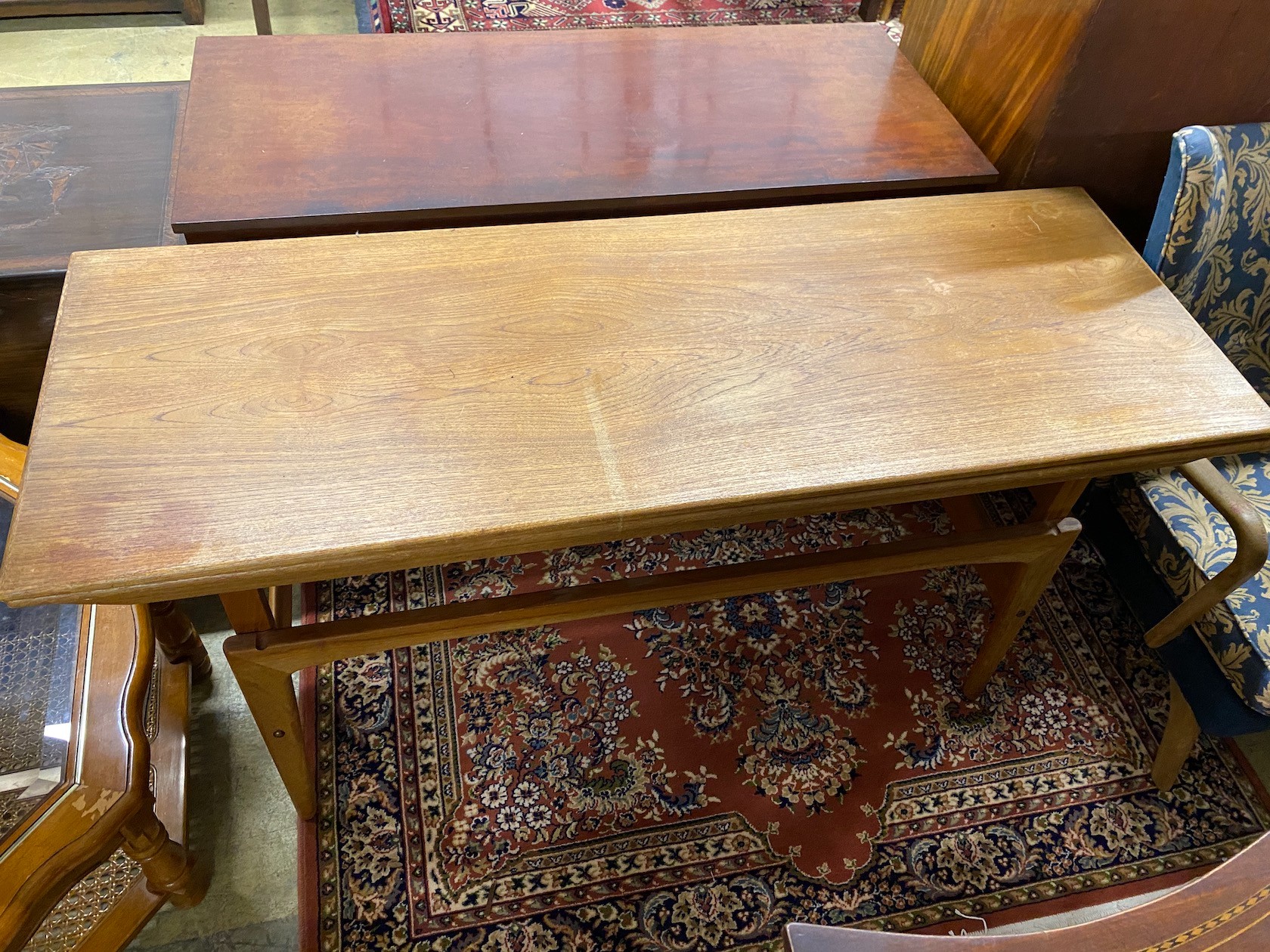 A mid century Trioh type “Copenhagen” metamorphic teak coffee / dining table, width 150cm, depth 54cm, height 72cm and a Nathan teak square occasional table.